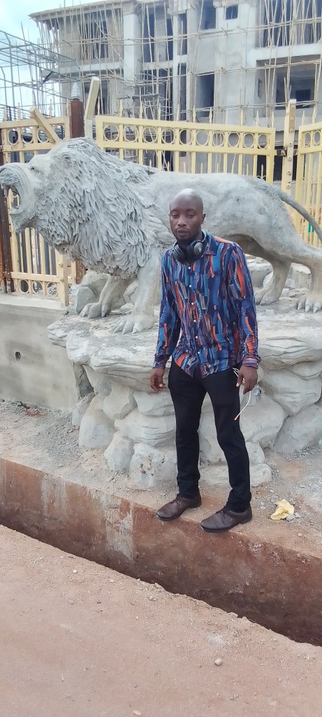 After the completion, I took a photo with one of the lion's in Agbor, Delta State.